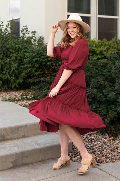 Deep red dress with a tiered skirt