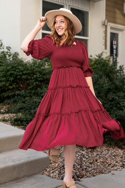 Deep red dress with  a ruffle on the skirt