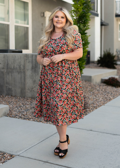 Plus size black dress with short sleeves and red flowers