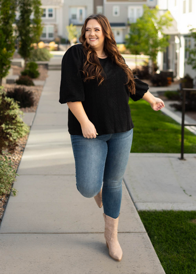 Plus size black top with textured fabric