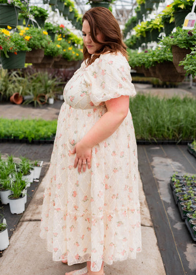Side view of the cream rose dress in plus size