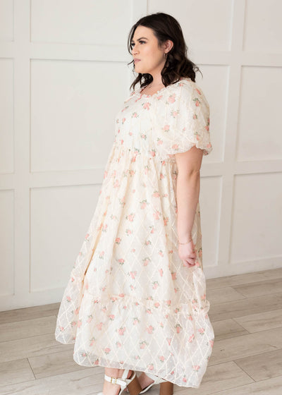 Side view of the plus size cream rose dress