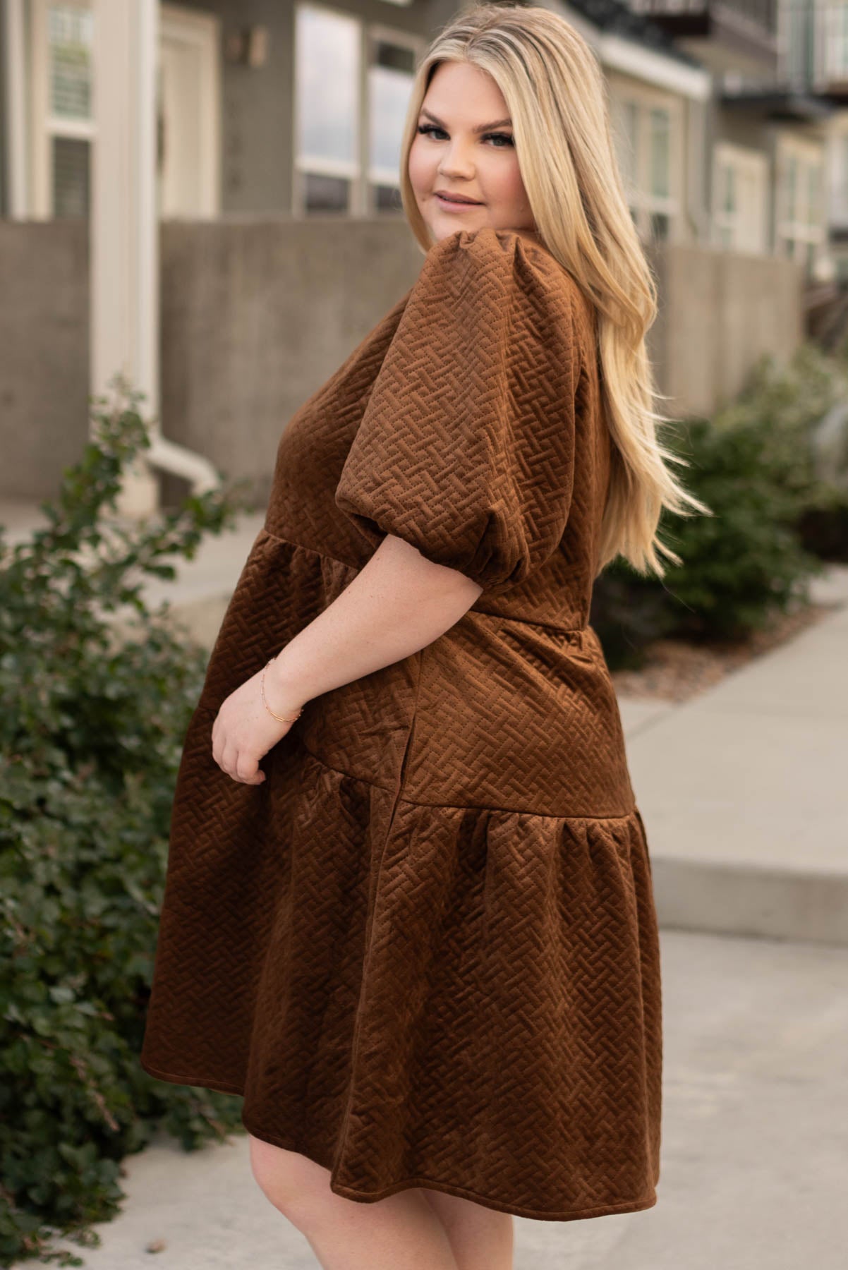Side view of the plus size chocolate dress