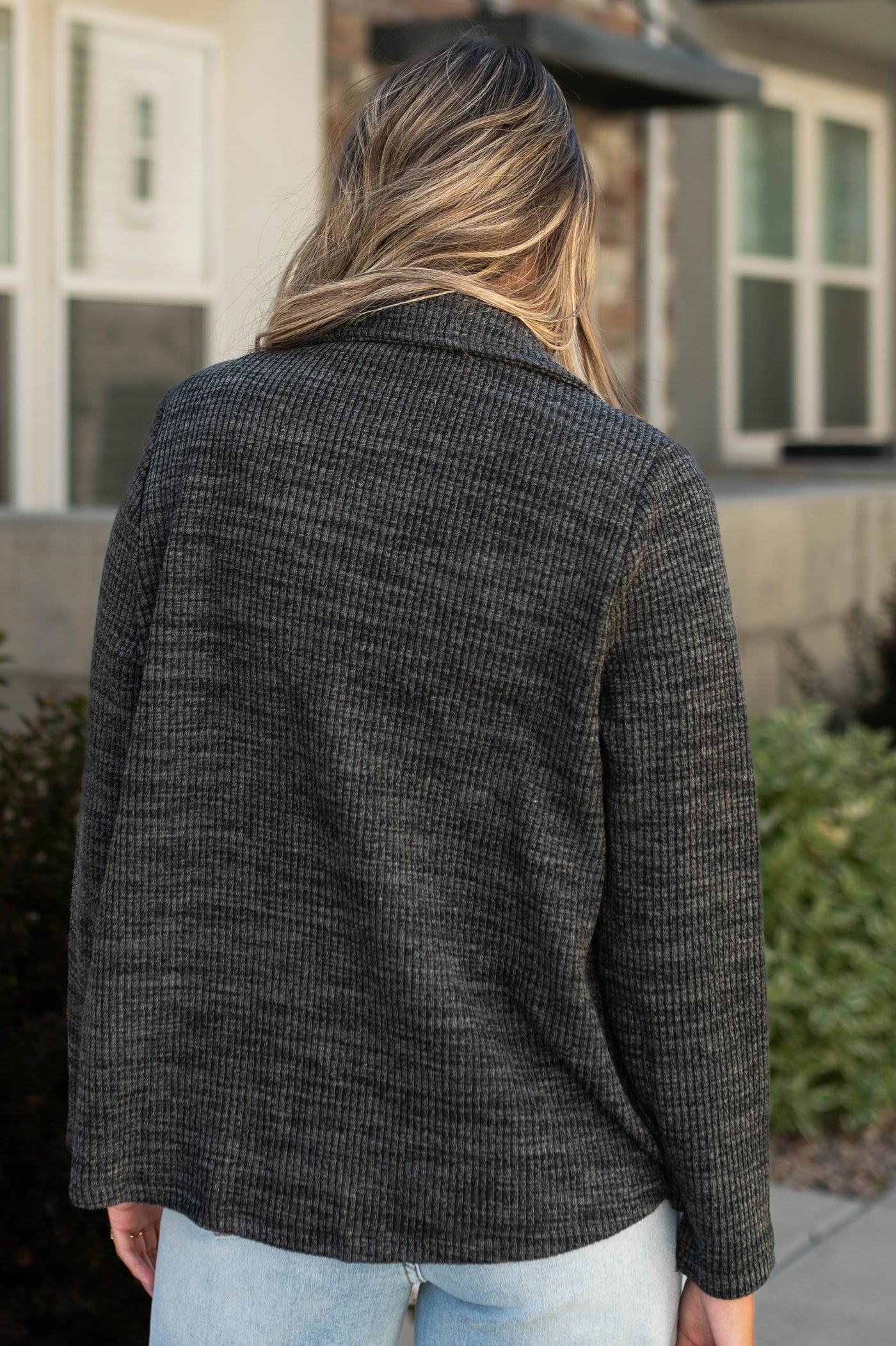 Back view of a charcoal blazer