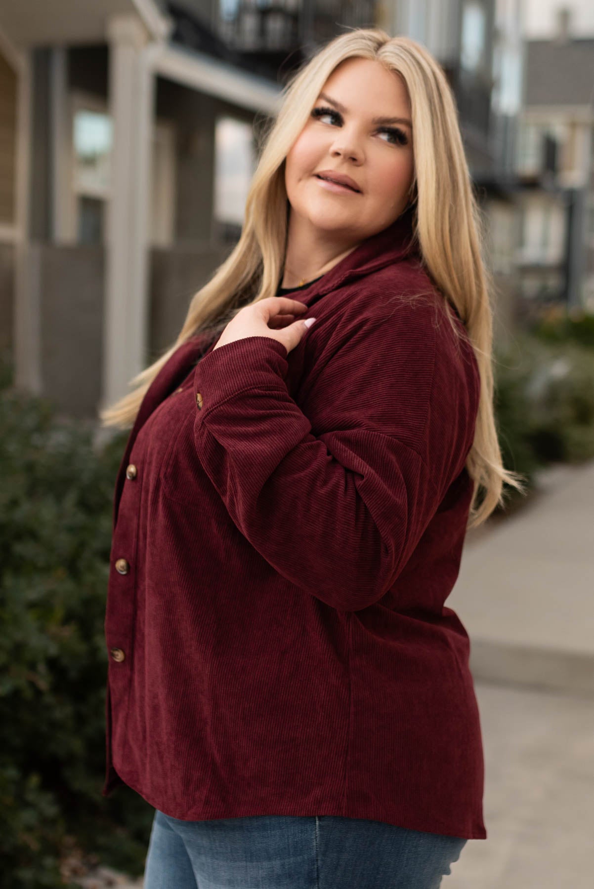 Side view of a plus size wine shacket