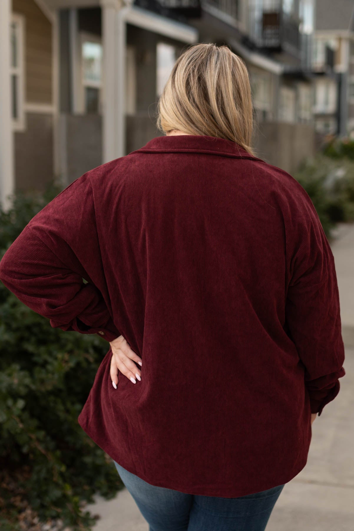 Back view of a plus size wine shacket