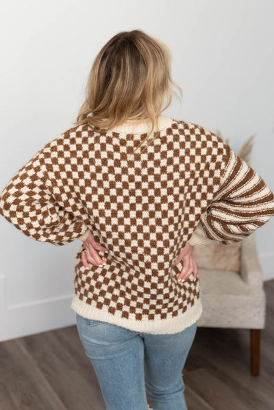 Back view of the brown checkered sweater