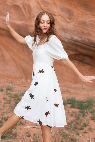 Short sleeve ivory dress with smocked bodice