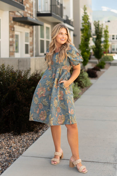 Knee length teal floral dress with short sleeves