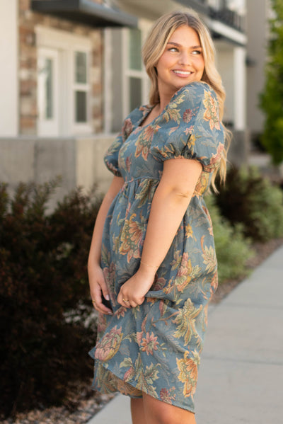 Side view of a teal floral dress