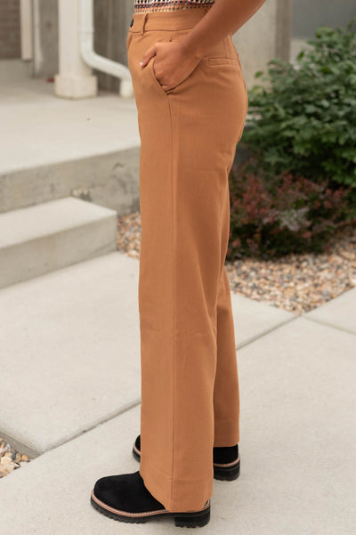 Side view of caramel pants with pockets