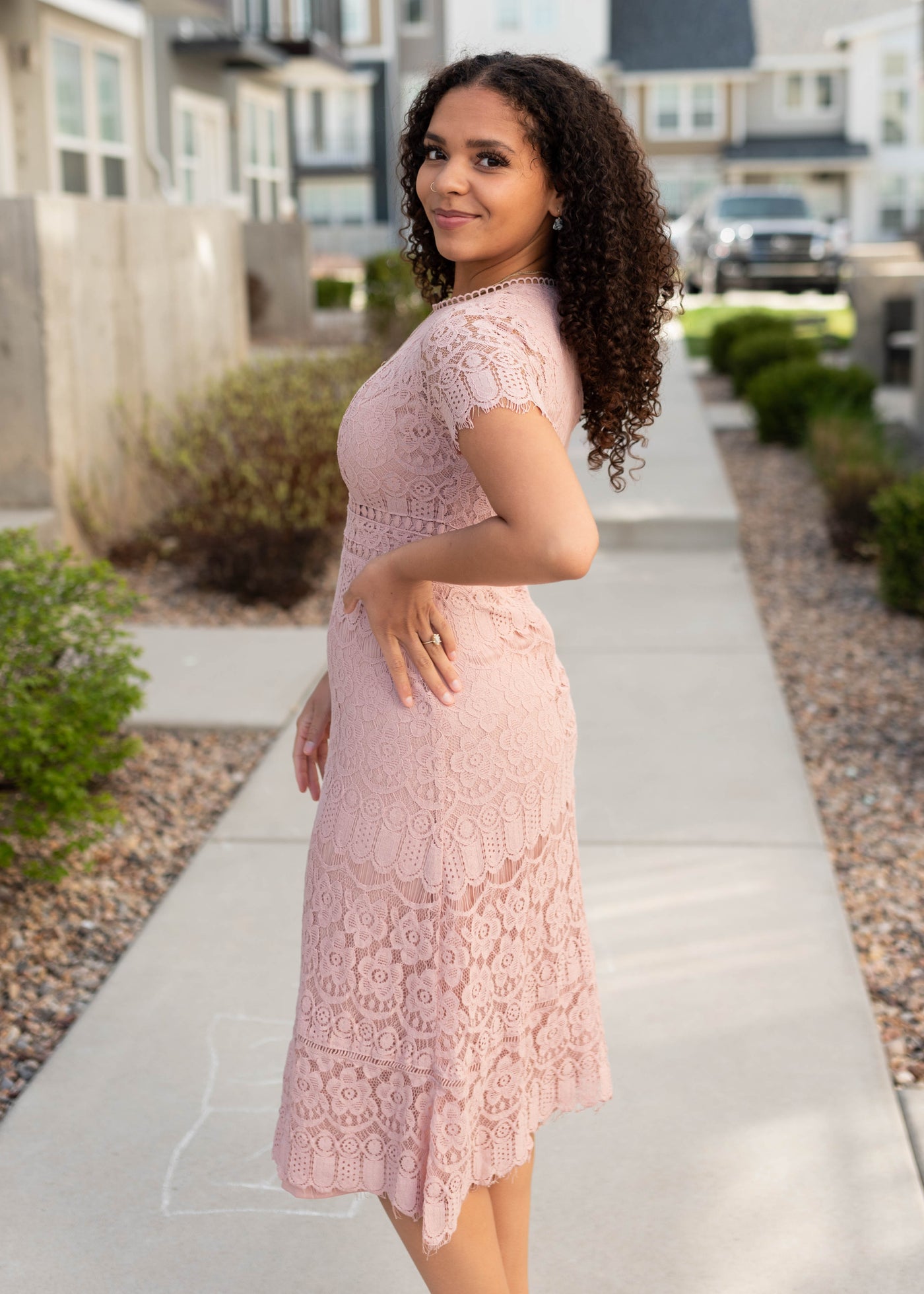Side view of the dusty pink lace dress
