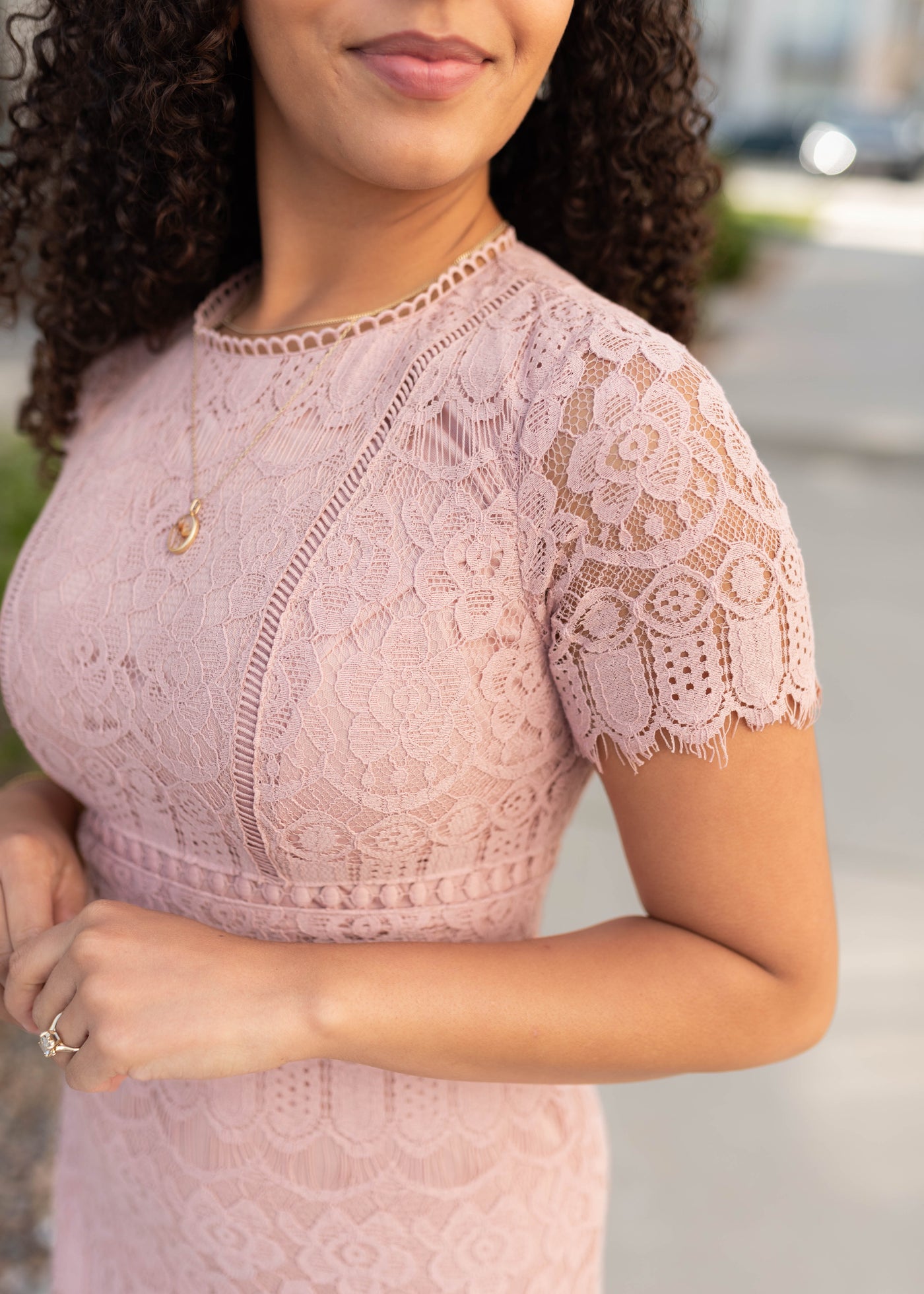 Close up of the fabric on the dusty pink lace dress
