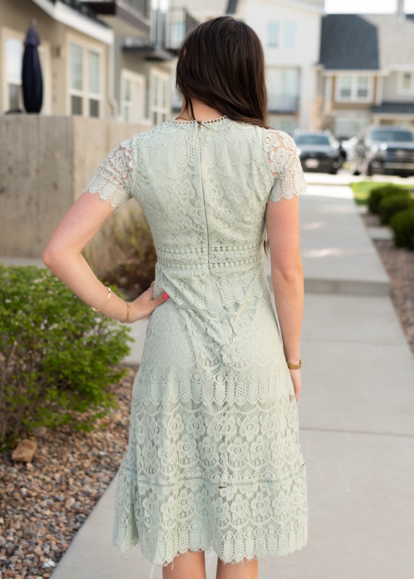 Back view of the light sage lace dress