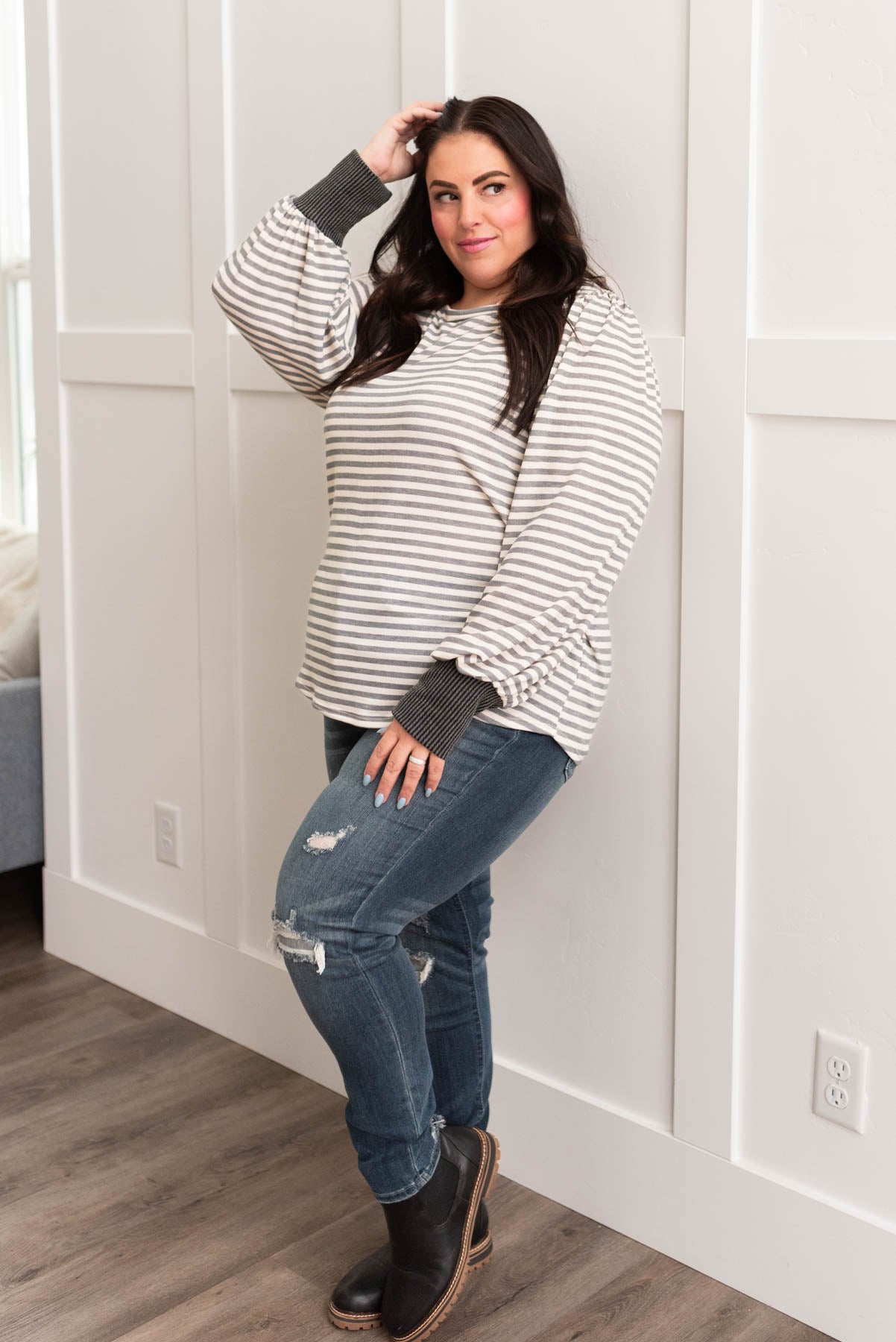 Wide charcoal grey cuffs on a plus size grey striped long sleeve top