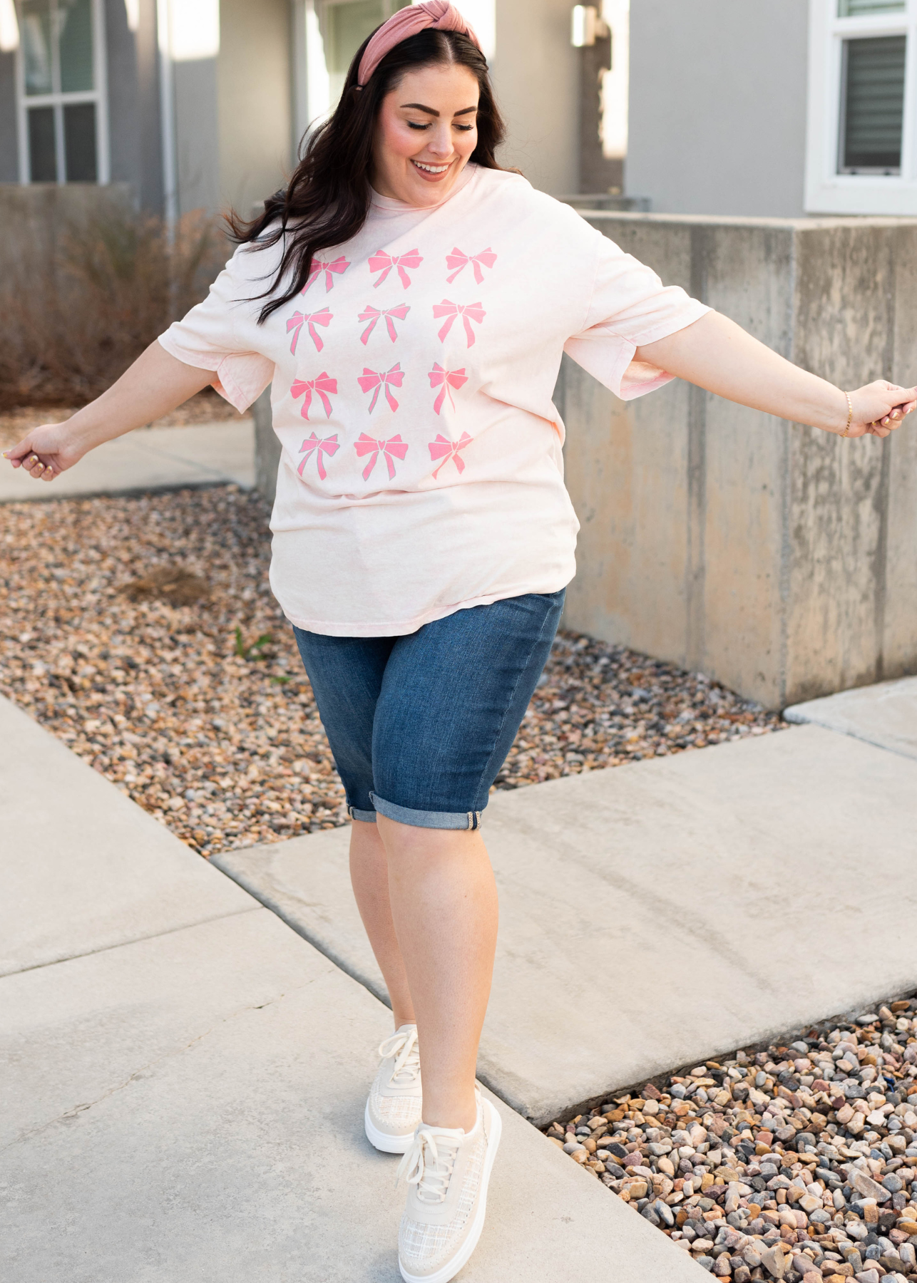 Plus size light pink ribbon graphic tee with darker pink ribbons