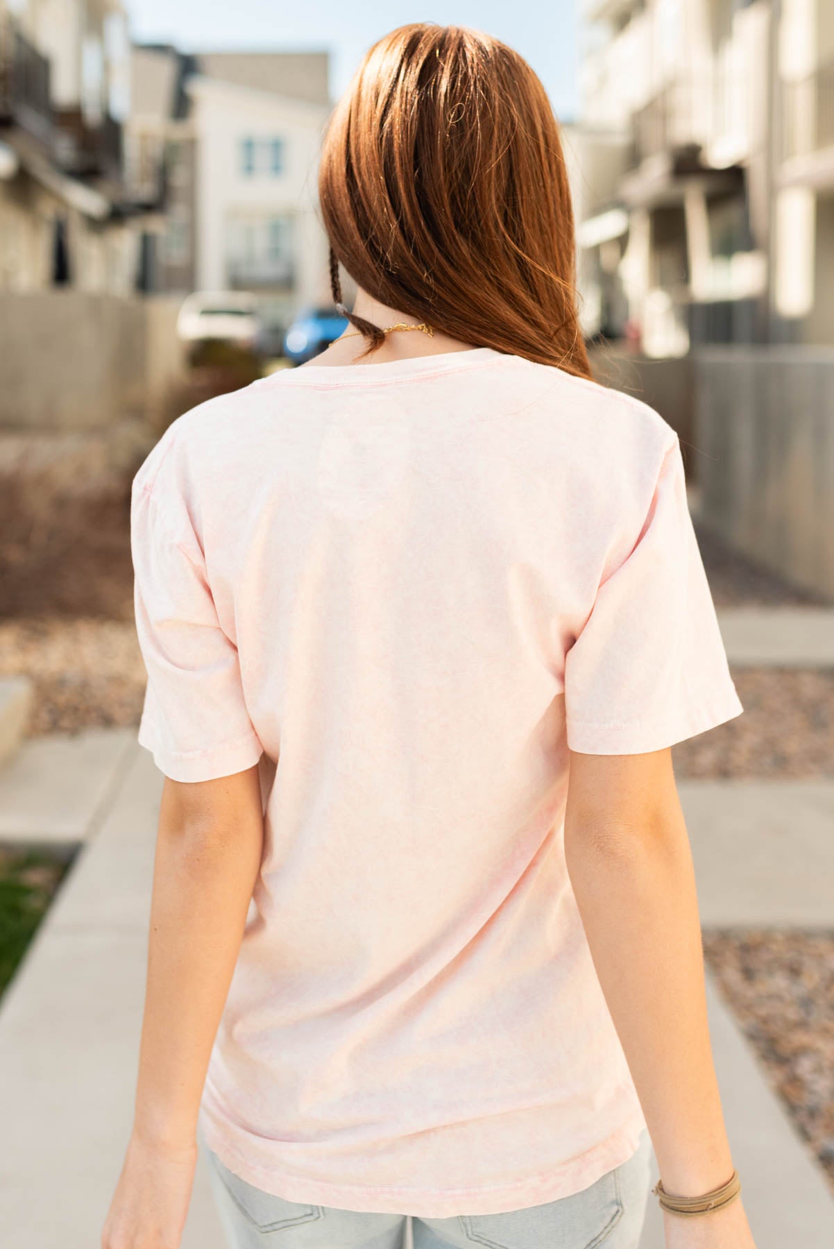 Back view of the light pink ribbons graphic tee