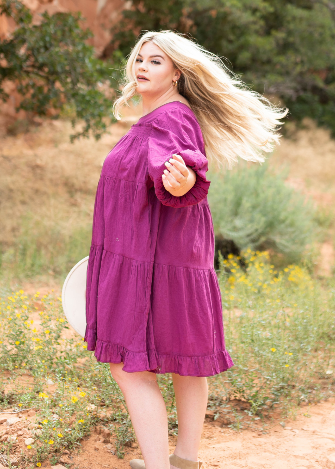 Plus size berry dress with a tiered skirt and ruffle at the bottom