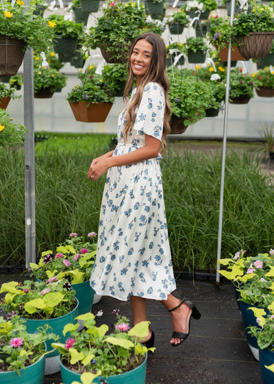 Side view of the short sleeve blue flroal dress