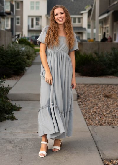 Short sleeve slate grey dress with a ruffle at them hem