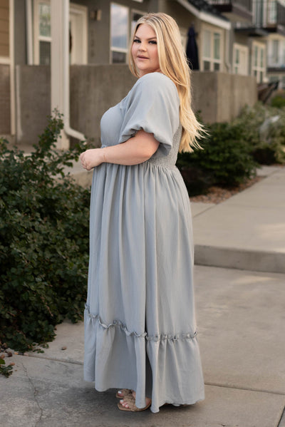 Side view of a plus size slate grey dress