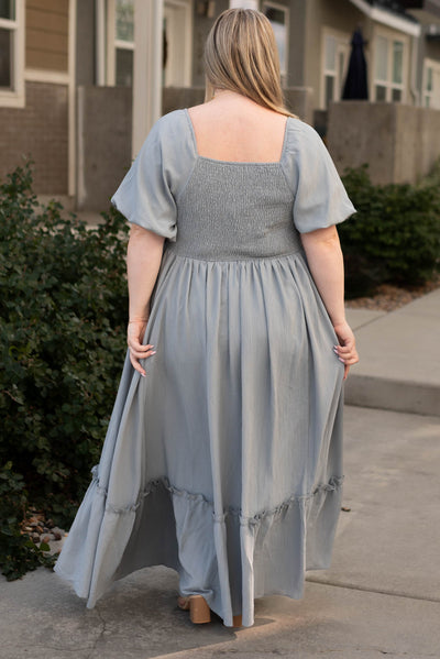 Back view of a slate grey dress with a square back