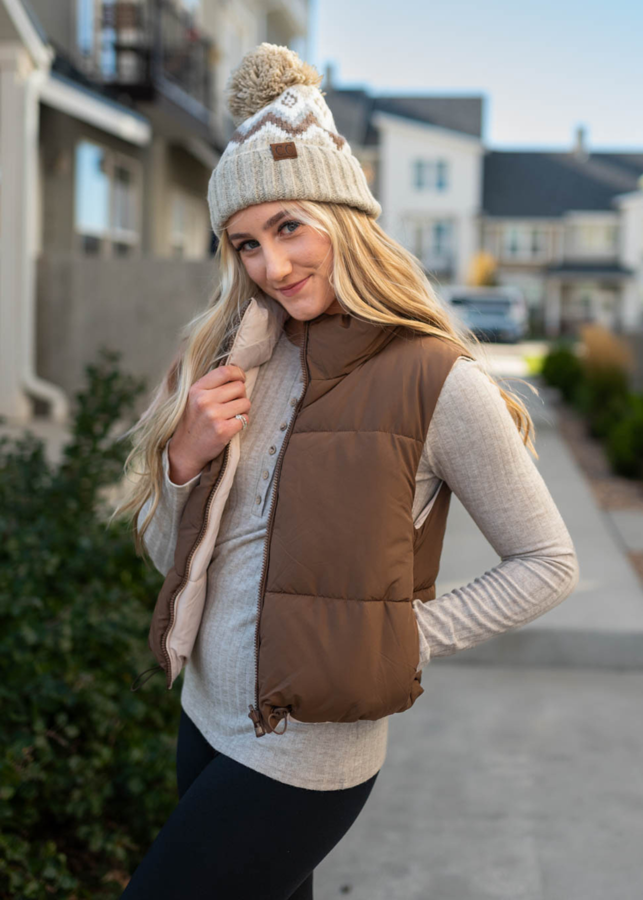 Front view of a cocoa reversible puff vest