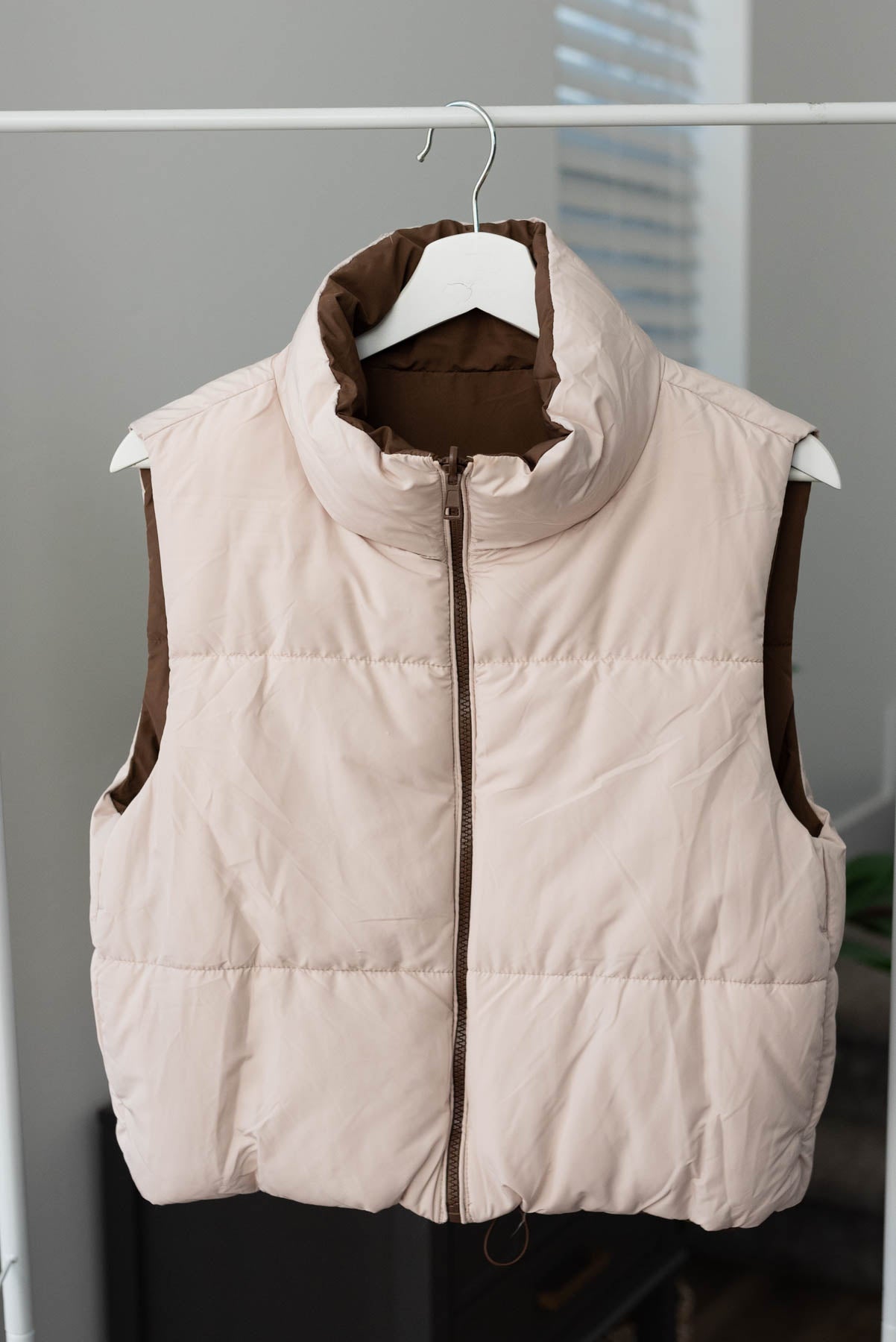 Blush side of the cocoa reversible puff vest
