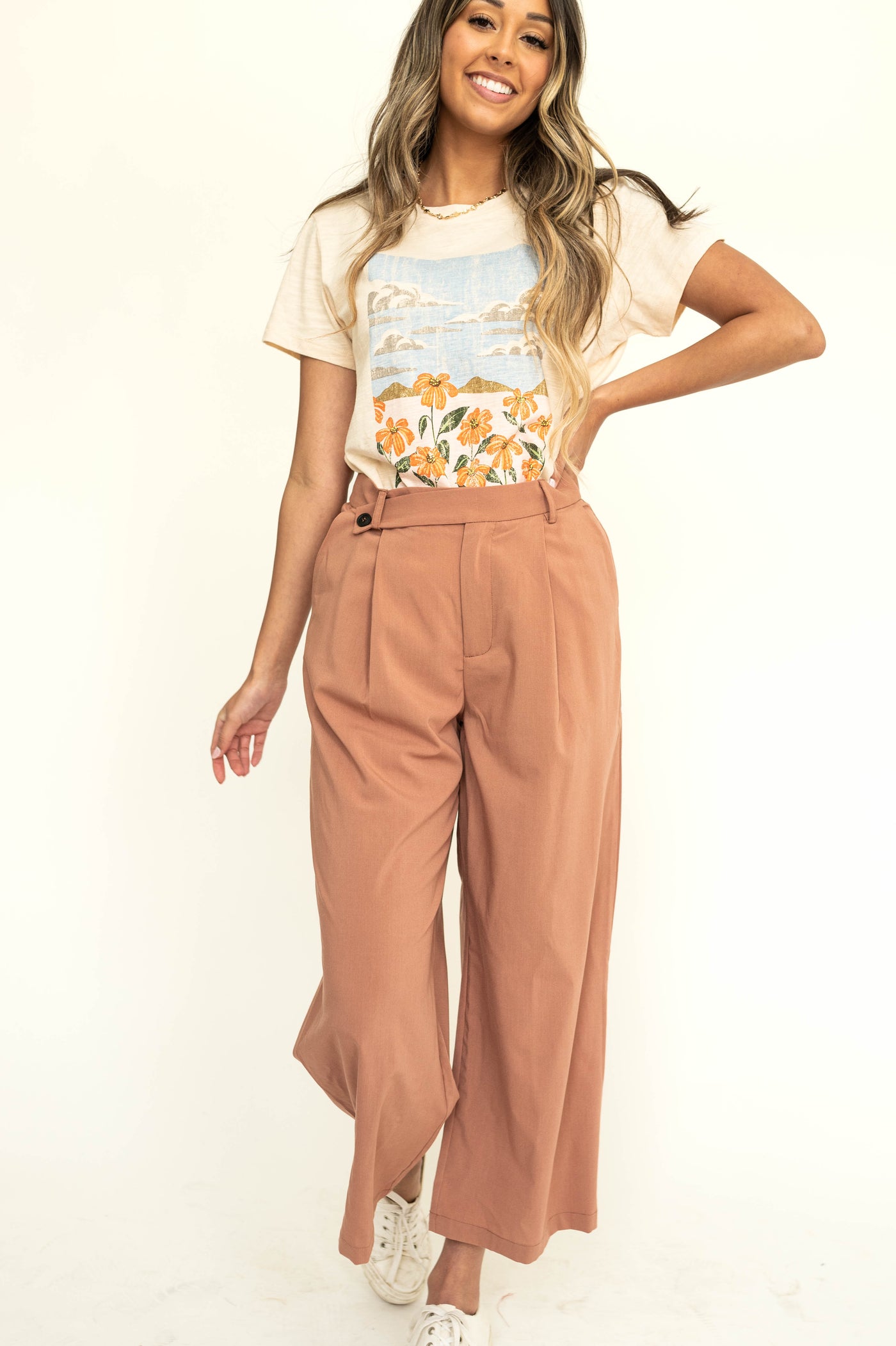 Caramel wide leg pleated pants with button at waist.