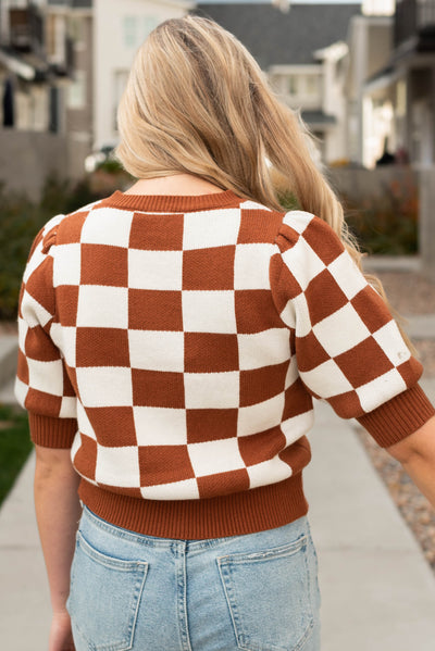 Back view of the camel sweater with short sleeves