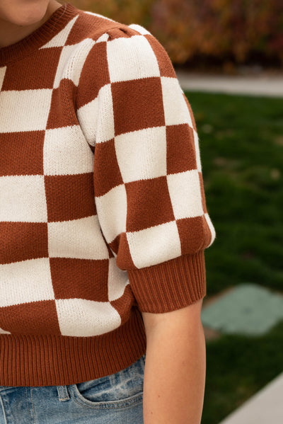 Sleeve view of the camel sweater