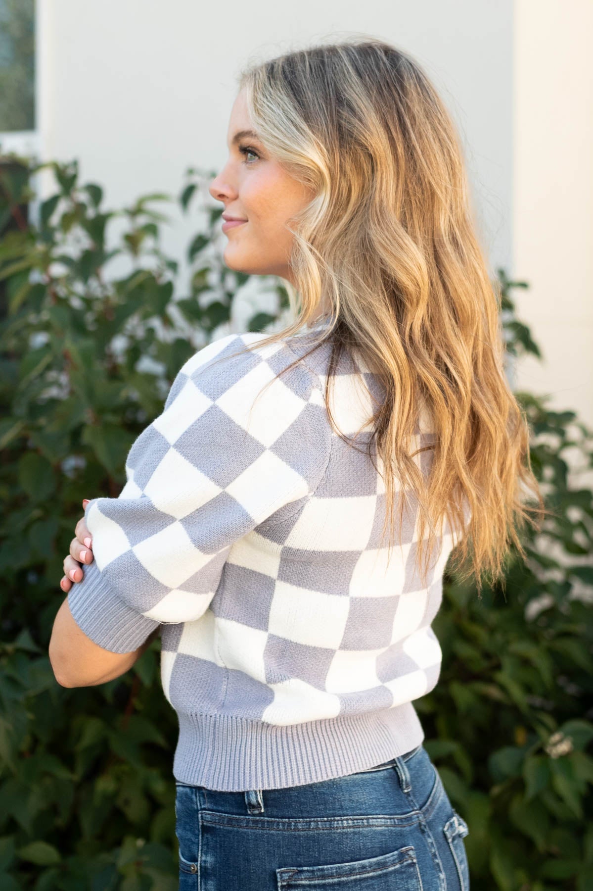 Side view of a dusty lavender sweater