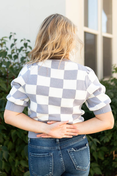 Back view of a dusty lavender sweater