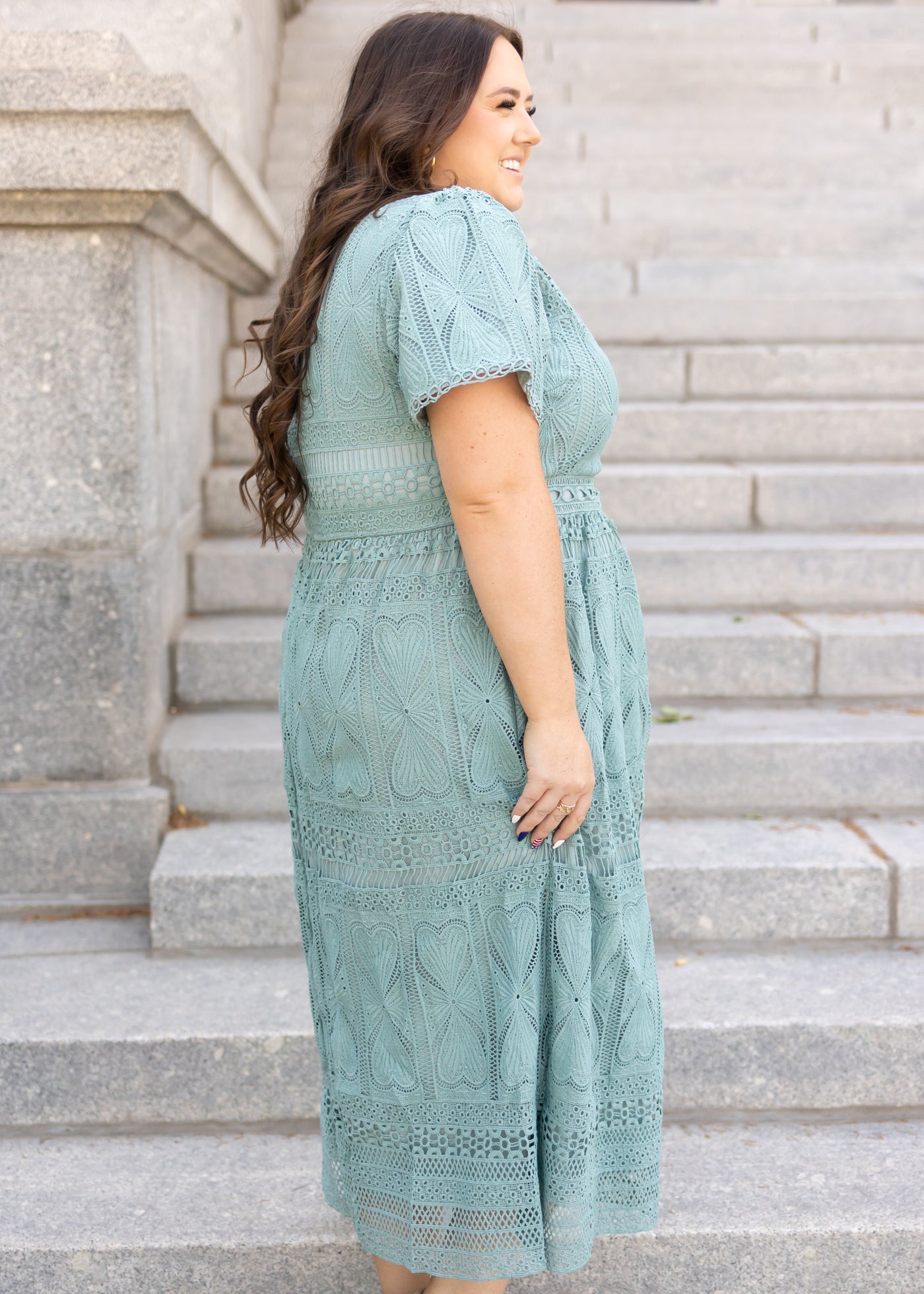 Side view of plus size dark seafoam dress
