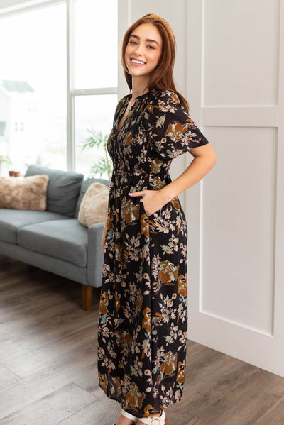 Side view of the black floral dress with pockets