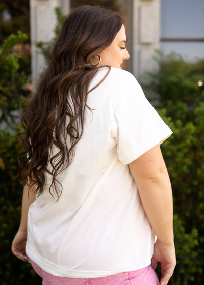Side view of a plus size sunset white tee