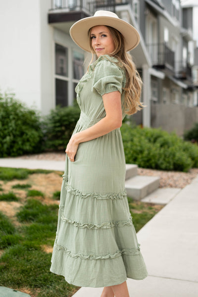 Side view of a short sleeve sage dress