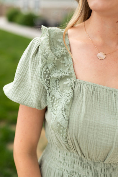 Sage dress with square neck