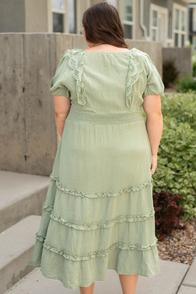 Back view of a plus size sage dress