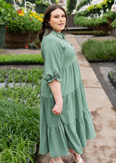 Side view of the green collared tiered dress in plus size