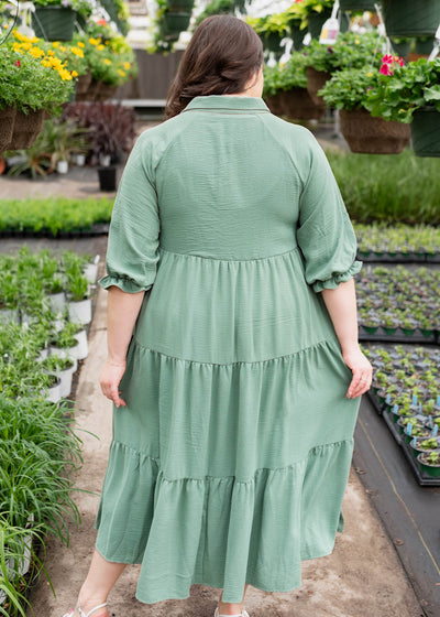 Back view of the plus size green collared tiered dress