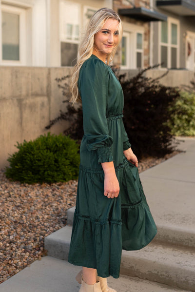 Side view of a hunter green dress