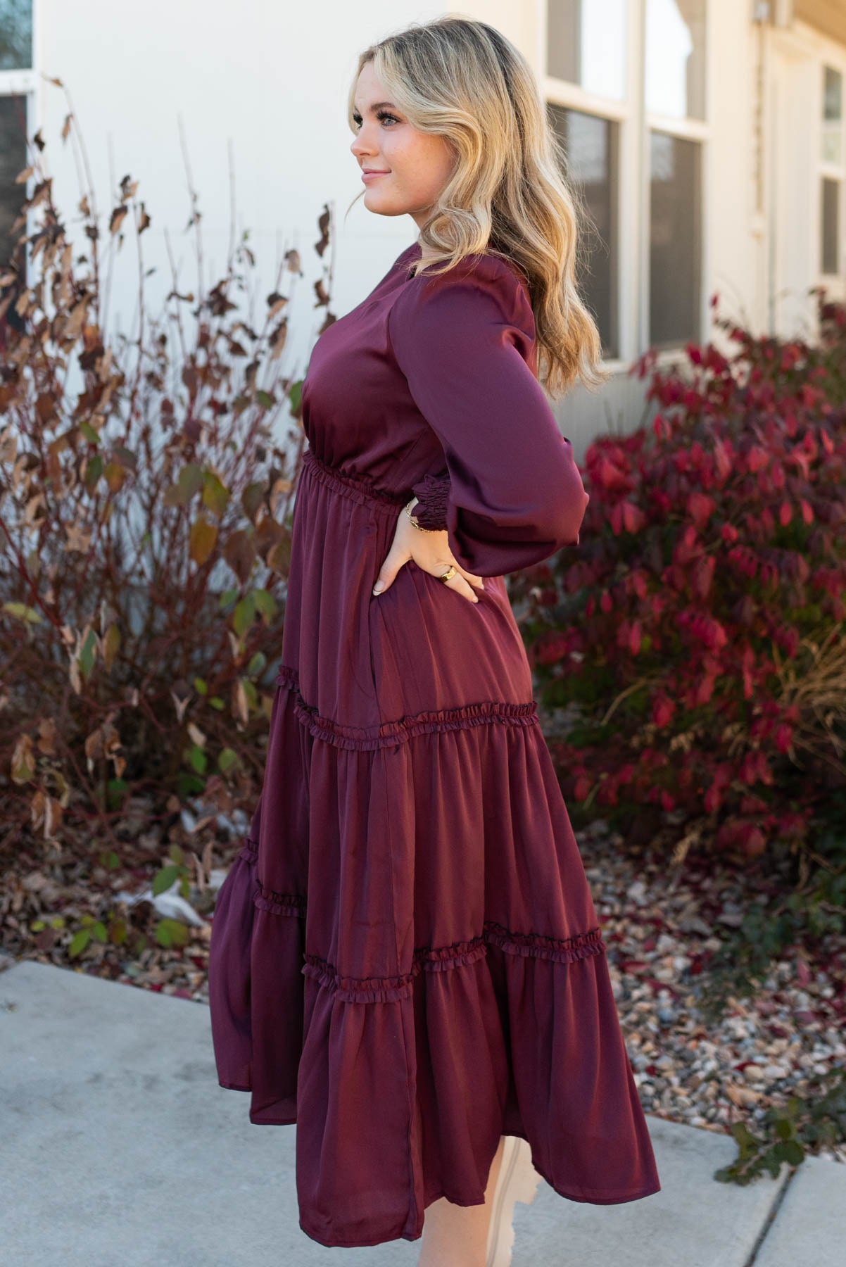Side view of the plum dress with a tiered skirt