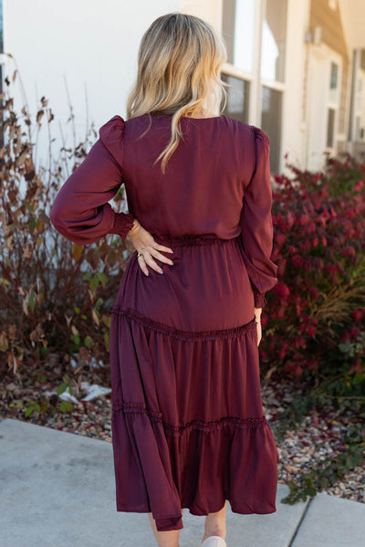 Back view of the plus dress with long sleeves