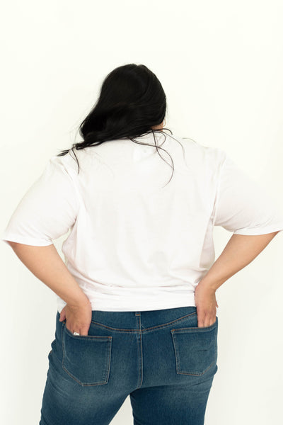 Plus size back view of brave white tee