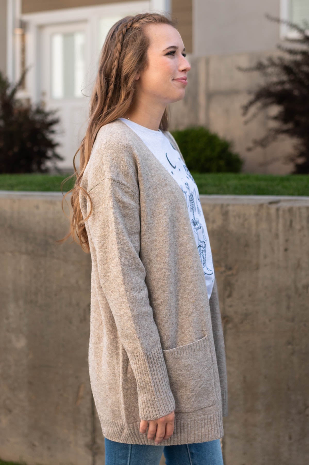 Side view of a camel cardigan