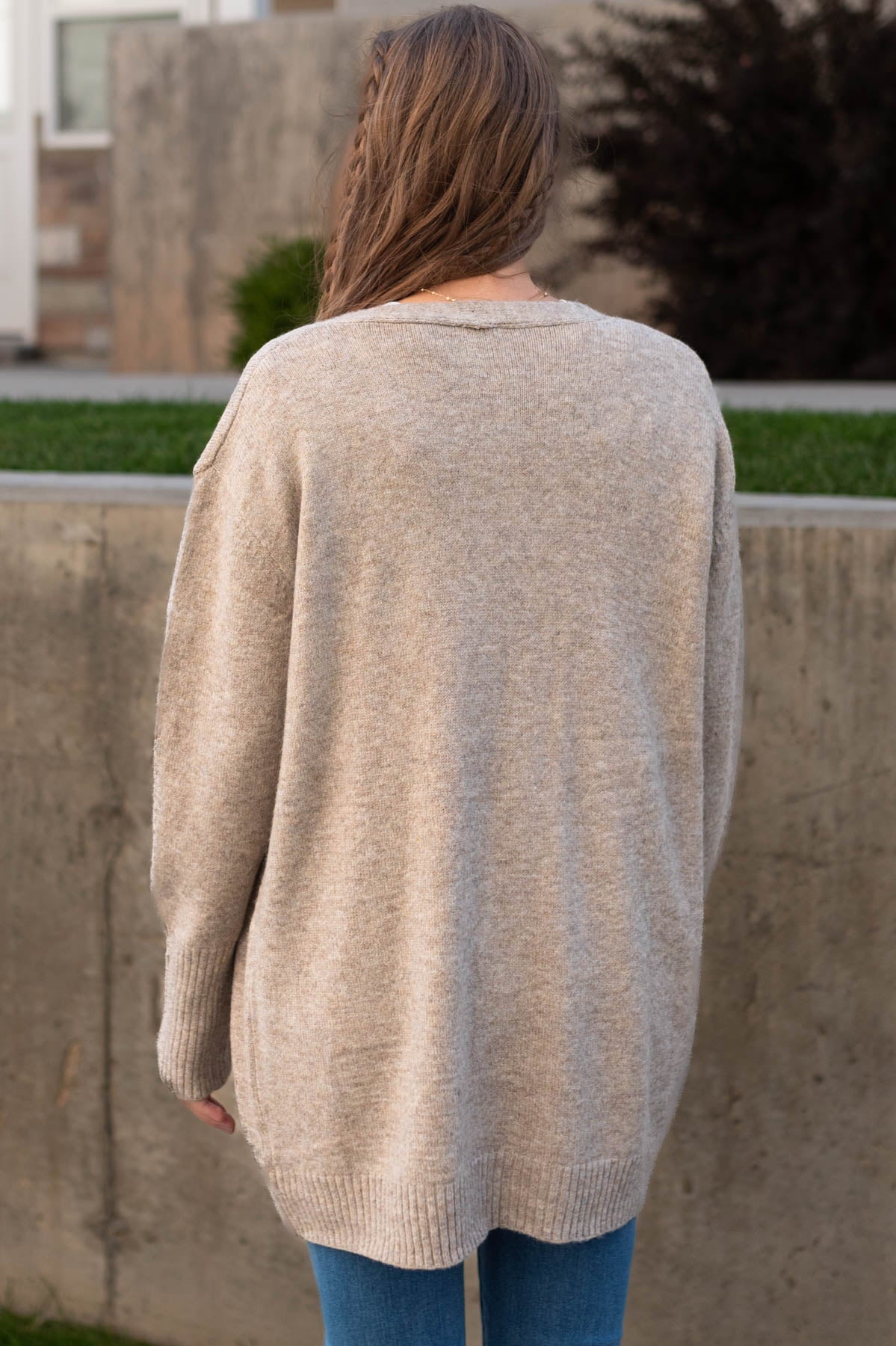 Back view of a camel cardigan