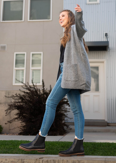 Side view of a grey cardigan