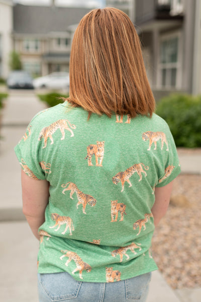 Back view of a vintage green top with tigers