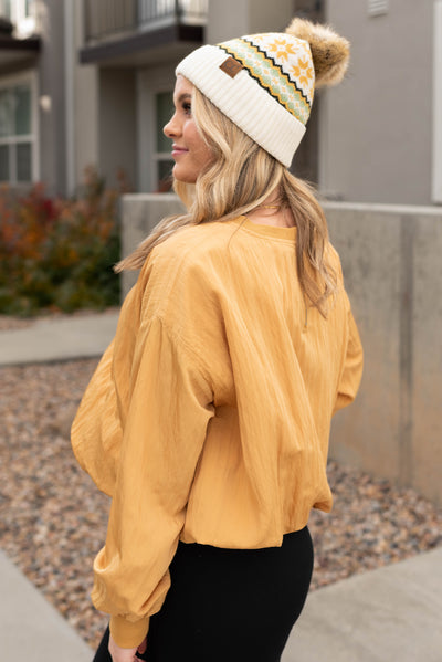 Side view of the mustard parachute blouse